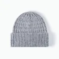 Grey ribbed knitted beanie hat detail, cozy winter warm wool blend cuffed cap texture view. - One Size / Dark Gray