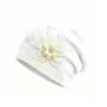 Detailed view of white knitted beanie featuring 3D fabric flower and rhinestone details. - M (56-58cm) / White