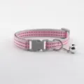 Detailed view of pink and grey reflective cat collar with safety buckle and cute bell. - Pink