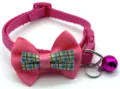 Close-up of pink pet collar detail, featuring bowknot decor, plastic buckle and metal bell. - Rose Red