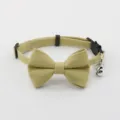 Pet collar detail shot showcasing the elegant khaki fabric bowknot and ringing bell accessory. - Yellow-Green