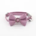 Close up detail of purple pet collar featuring sparkly rhinestone bow and metal bell. - Bowknot Choker / Light Purple