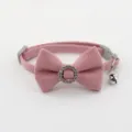 Detailed view of the pink pet collar featuring a cute fabric bow and sparkly rhinestone ring. - Bowknot Choker / Pink