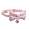 Pink plaid pet collar with bow and bell, detailed view of cute cat and dog neck accessories. - Pink Plaid