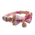 Pink floral cat collar detail close-up, featuring a cute bow and a sweet cherry blossom bell. - Pink Flower