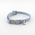 Detailed shot of a light blue denim pet collar with grey plastic buckle and a small silver bell. - Collar Only (Without Leash) / Sky Blue
