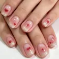 Close-up detail of short square press-on nails with pink gradient and glitter tips. - Pink Gradient Heart Glitter (YS399-No Tools)