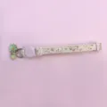 Close-up detail view of the floral pet collar featuring a cute cat buckle and a green bell pendant. - Light Green