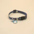 Adjustable denim pet collar featuring a bell and cute paw print pendant for cats and dogs detail - Dark Blue
