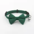 Green velvet pet collar with bow and bell for cats and small dogs close up detail. - Dark Green
