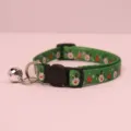 Christmas pet collar detail view, green fabric with cute reindeer and tree patterns, metal bell. - Green Elk