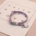 Purple pet cat collar with adjustable strap, cute bell and paw pendant for small dogs and cats. - Purple Stitching