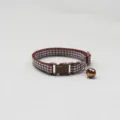 Brown checkered pet collar detail, soft fabric strap with durable plastic buckle and copper bell. - Brown