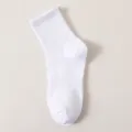 Detailed view of plain white cotton crew sports sock, showcasing soft texture and knit. - Crew Socks / 13cm / White