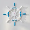 Mediterranean style wooden ship wheel wall hanging detail, nautical decor with rope and shells. - 34cm Blue and White Sailboat Style