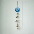 Mediterranean style wall hanging wind chime, blue anchor home decor accessory with wooden beads. - White