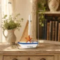 Modello di barca a vela in legno in stile mediterraneo con vela in juta e stella marina. - Barca di Tela Stile Stella Marina