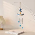 Campanello a vento barca a vela mediterraneo con stelle blu e tubi in metallo casa. - Stile ancora