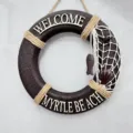 Mediterranean nautical style wooden life ring wall hanging detail with decorative rope and shell. - 30cm Lifebuoy
