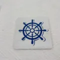 Nautical wooden drink coaster with blue ship wheel pattern, perfect for kitchen table and coffee. - Helmsman Style / Pack of 4