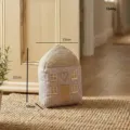 Mediterranean style fabric house door stop with cute heart embroidery and striped design. - Pink