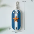 Gancio da parete in legno stile mediterraneo con design a stella marina e pesce. - Gancio Stella Marina Blu Scuro Ovale