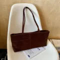 Brown suede tote bag for women, casual minimalist shoulder bag with long straps and front pocket. - Ebony