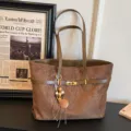 Brown leather tote bag for women, large capacity vintage shoulder bag with chic belt design. - With Pendant / Brown