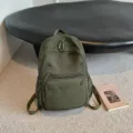 Army green casual backpack for women, multi-pocket school bookbag for outdoor travel and daily use. - Green