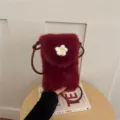 Red plush crossbody phone bag for women, cute fuzzy mini shoulder bag with flower decor. - Red