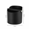 Stainless steel coffee knock box detail showing black cylindrical body with removable knock bar. - L / Black