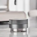Stainless steel coffee distributor detail view, adjustable height tamper tool for espresso making. - 51mm / Silver