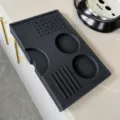 Silicone coffee tamper mat detail, non-slip corner espresso pad with multi slots for home baristas. - Black