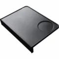 Black silicone coffee tamping mat, corner design detail, durable espresso bar accessory. - Black