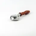 Stainless steel 58mm bottomless portafilter detail shot with wooden handle for coffee maker. - Rosewood Curved Handle