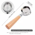 Detail shot of a 58mm espresso portafilter with wood handle and stainless steel basket. - Double Ear Bottomless Handle / Stainless Steel & Beech Wood