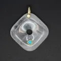 Detail view of the square crystal pendant with gold bail and turquoise inlay. Elegant jewelry. - White Crystal
