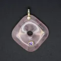 Rose quartz square peace buckle pendant detail view featuring gold bail and purple inlay stone. - Rose Quartz