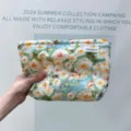 Detail view of the large capacity oil painting cosmetic bag for travel and daily storage use. - Sunny Wild Chrysanthemum - Large
