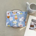 Cute blue checkered cosmetic pouch with adorable dog patterns and handy braided strap. - Blue Plaid Ice Cream Puppy