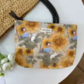 Sunflower print canvas cosmetic bag featuring cute cartoon illustrations and woven handles. - Sunflower Fairy Tale
