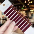 Detailed view of dark red acrylic hair clips featuring handmade design with card display. - 10 Pieces/Pack / Burgundy