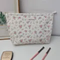 Floral print cotton makeup pouch with secure zipper, portable cosmetic organizer for daily use. - Milky White Floral Collection