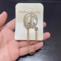 Exquisite rhinestone Eiffel Tower brooch with hanging chains, elegant lapel pin accessory. - Tower Star Style (18)