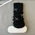 Black knit leg warmers with silver bows, Y2K Lolita style winter warm calf socks accessory detail. - Black