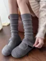 Detail view of grey knit slouch wool socks and shoes, soft and warm for autumn and winter daily wear. - One Size / Gray