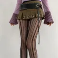 Detailed view of black striped hollow-out tights featuring delicate vertical jacquard patterns. - Black