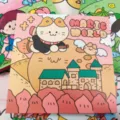 Leuke vierkante cartoonnotitieboekplanner met kat en kasteel coverontwerp voor dagelijks schrijven. - Magische Wereld