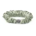 Silk satin scrunchie detail view with elegant pleated texture and central bead accessory. - 2 Green