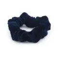 Detailed view of dark blue velvet scrunchie, soft pleated hair tie for elegant ponytails. - Navy Blue